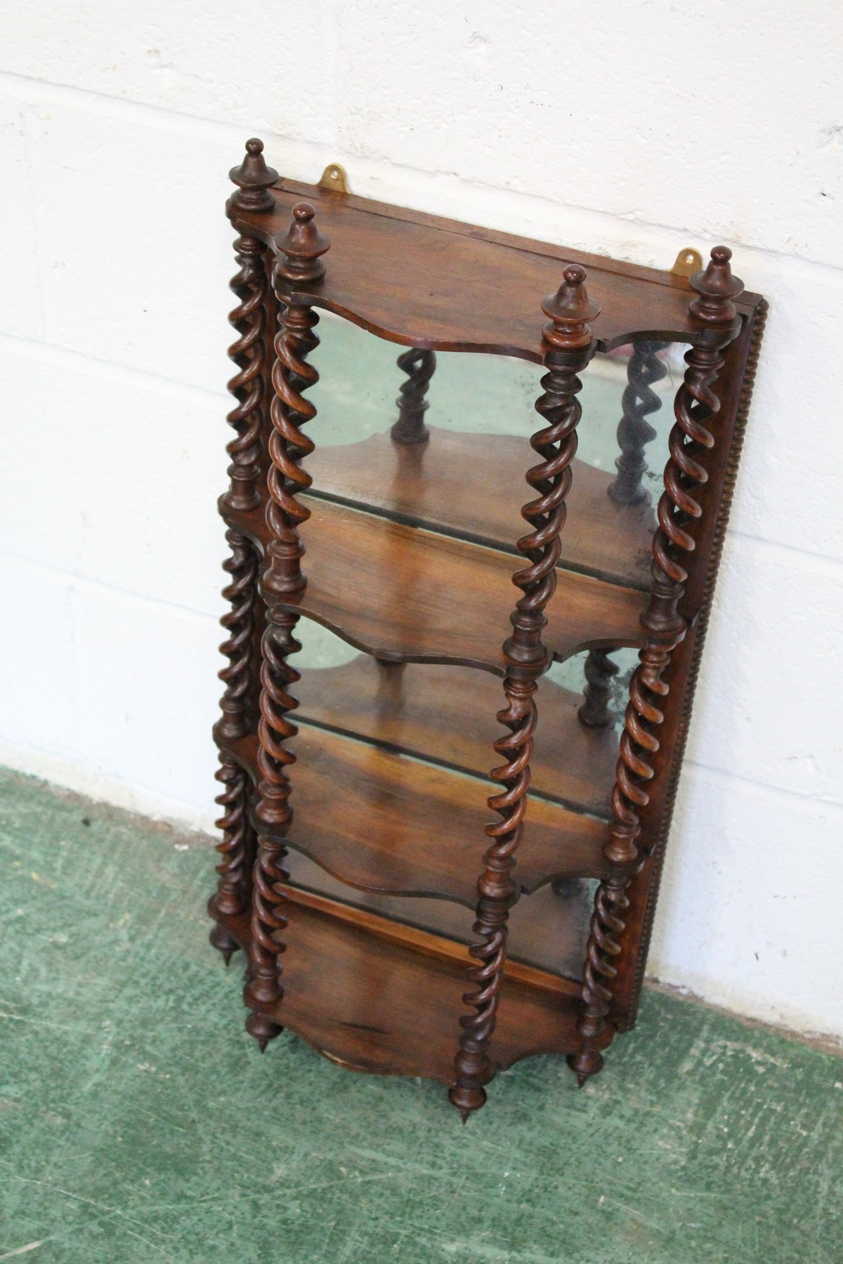 A GOOD 19TH CENTURY ROSEWOOD WALL SHELF, with a mirrored back, the shelves united by open barley - Image 2 of 4