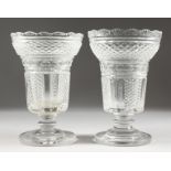 A GOOD PAIR OF HOBNAIL CUT PEDESTAL GLASS VASES ON CIRCULAR BASES. 8.5ins high.