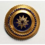 A VICTORIAN 15CT GOLD, ENAMEL, SAPPHIRE AND DIAMOND CIRCULAR BROOCH.