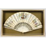 A GOOD FRENCH IVORY AND PAPER FAN in a glass case.