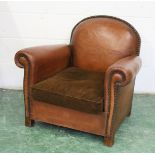 A 1930'S BROWN LEATHER UPHOLSTERED ARMCHAIR. 2ft 7ins high x 2ft 11ins wide.