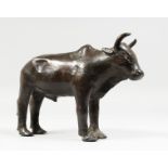 A BRONZE MODEL OF A STANDING BULL. 9ins long.