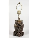 A CHINESE CARVED SOAPSTONE LAMP. 23ins high, in a light fitting.