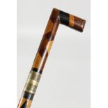 A VICTORIAN MULTI-COLOURED WOOD SWORD STICK. Stamped S. TOLEN FROM T. BROOKSBANK. 27ins long.