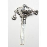 A SMALL SILVER RATTLE WITH MOTHER-OF-PEARL HANDLE. 3.25ins long.