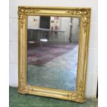 A 19TH CENTURY FRENCH GILT FRAMED MIRROR, with decorative moulded corners and original glass. 2ft