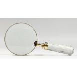 A MAGNIFYING GLASS.