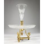 A GOOD CUT GLASS AND ORMOLU CENTREPIECE, with trumpet shaped flower holder, circular dish on an