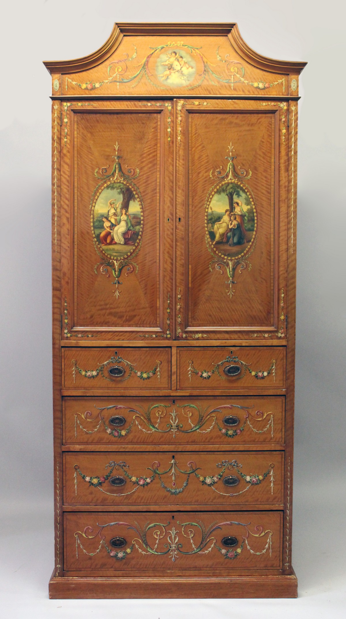 A VERY GOOD EDWARDIAN SHERATON REVIVAL SATINWOOD AND PAINTED WARDROBE, with a shaped cornice, pair