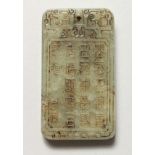 A CHINESE JADE PENDANT DECORATED WITH CALLIGRAPHY. 2.5ins high.