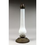 AN OPAQUE GLASS AND BRASS LAMP BASE.