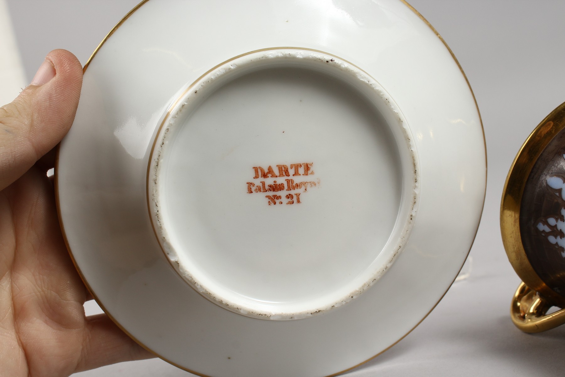 A DARTE PORCELAIN THREE FOOTED CABINET CUP AND SAUCER, painted with a soldier and a gentleman - Image 7 of 7