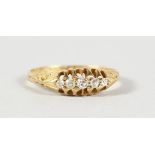 AN 18CT GOLD FIVE STONE DIAMOND RING.