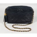 A BLUE CHANEL BAG with gilt metal strap. 9.5ins long.