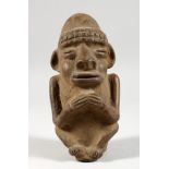 A NATIVE TERRACOTTA FIGURE OF A MAN. 6ins long.