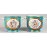 A LARGE PAIR OF 19TH CENTURY SEVRES PALE BLUE JARDINIERES, with shell handles and painted with putti