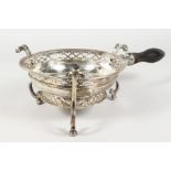 A RARE QUEEN ANNE CIRCULAR SILVER BRAZIER, pierced edge, scrolled feet and turned wood handle.
