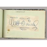 A 1952 AUTOGRAPH ALBUM, including Walt Disney, Fred Winter, Bing Crosby, Denis Compton, Clark