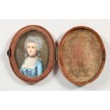 A SMALL 18TH CENTURY OVAL PORTRAIT MINIATURE OF A LADY. 2ins x 1.5ins, in a velvet case.
