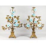 A PAIR OF 19TH CENTURY ORMOLU CANDELABRA, of naturalistic form, with leaves and flowers, the stems