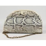 A CHANEL SNAKESKIN BAG with leather interior. Made in Italy. 11ins long.