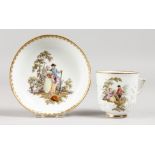 A MEISSEN COFFEE CUP AND SAUCER, prunus moulded ad painted with scenes of a courting couple.