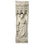 A RECONSTITUTED STONE RELIEF CAST PLAQUE OF A SAINT STANDING HOLDING A BOOK AND KEYS. 51ins high x