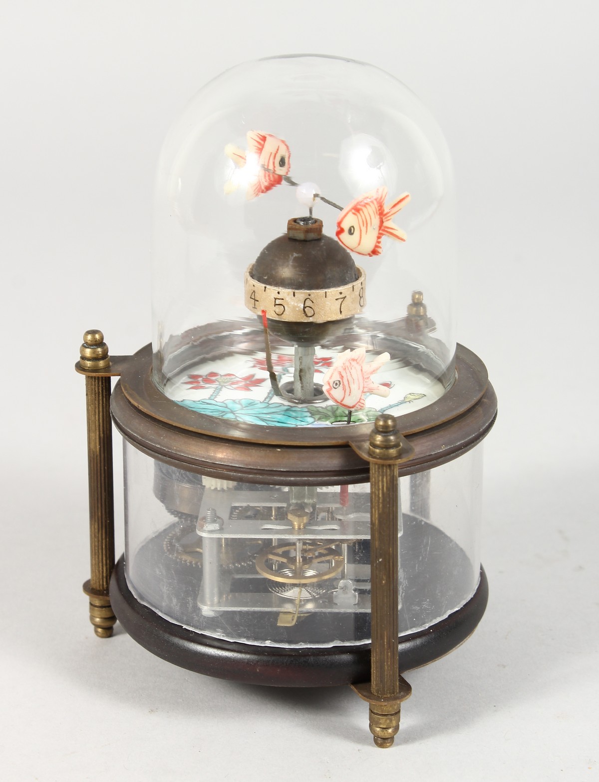 A NOVELTY AQUARIUM CLOCK. 6ins high.