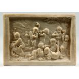 AFTER CLODION A SMALL MARBLE PLAQUE OF PUTTI AT PLAY. 7ins x 5ins.