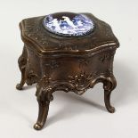 A BRASS AND ENAMEL JEWELLERY BOX.