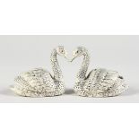 A PAIR OF .925 SILVER SWANS SALT AND PEPPER.