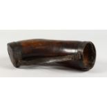 A LARGE EARLY 18TH CENTURY HORN DRINKING VESSEL with leather strap, dated 1710, with script. 11ins