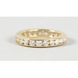 AN 18CT GOLD SINGLE-ROW DIAMOND ETERNITY RING.