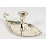 A BOAT SHAPED CHAMBER CANDLESTICK. Bears crest of The Barings Family.