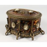A VERY GOOD 19TH CENTURY OVAL TORTOISESHELL CASKET, set with cameos. 7.5ins long.