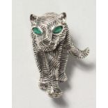 A SILVER DECO STYLE TIGER BROOCH.