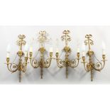 A SET OF FOUR CLASSICAL STYLE ORMOLU TWIN-BRANCH WALL APPLIQUES, with ribbons and swags. 22ins