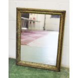 A decorative gilt framed mirror.