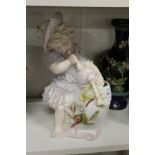 A figural posy holder.