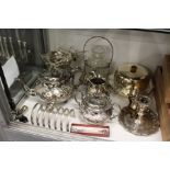 A plated three-piece tea service and other plated items.