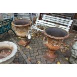 A good large pair of cast iron campagna shaped garden urns.