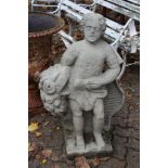 A good weathered garden figure, possibly sandstone, modelled as a man holding a bunch of flowers.