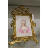 G Goger, head and shoulders portrait of a young lady on porcelain, in a decorative ormolu easel