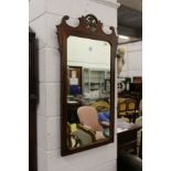 A George III style inlaid mahogany fretwork framed wall mirror.