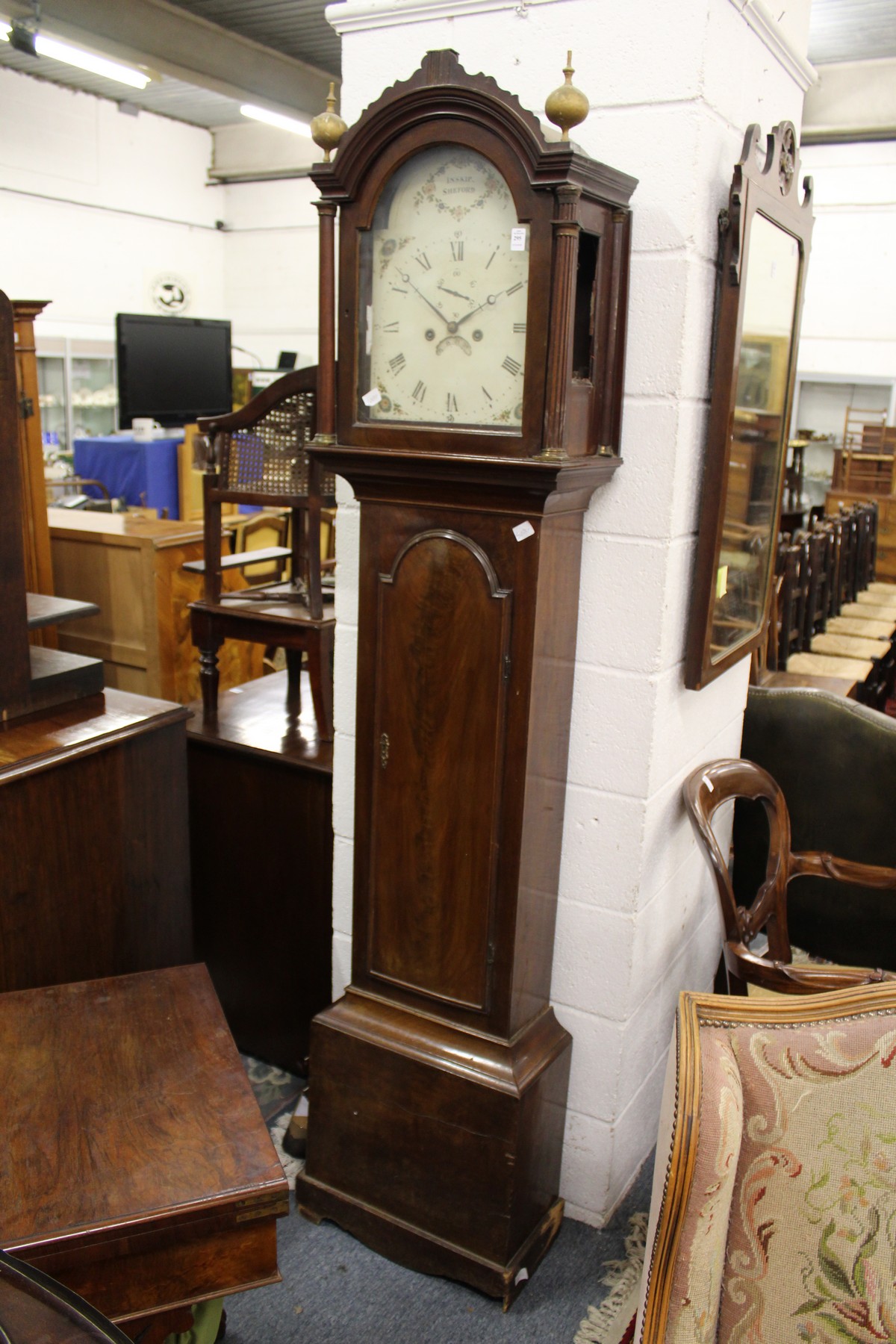 A 19th century mahogany long case clock with eight-day movement, the painted arched dial signed