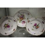 Three floral decorated cabinet plates.