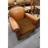 A 1930's leather upholstered club style armchair.