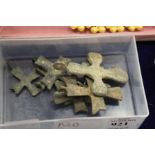 Ten small Roman cast metal crosses.