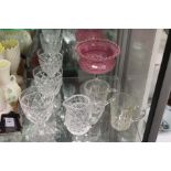 A cranberry colour and clear glass pedestal bowl and other cut glassware.
