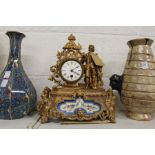 A French gilt decorated spelter mantle clock with porcelain panels.